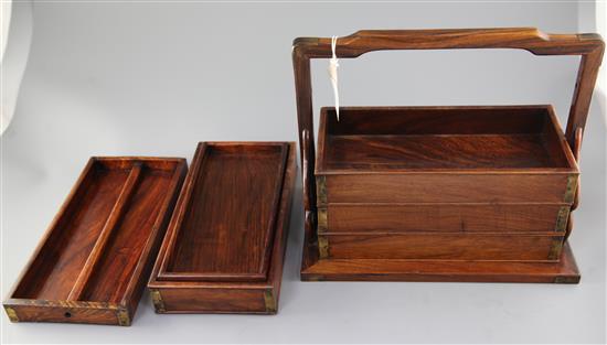 A Chinese huanghuali and brass mounted four section picnic basket, 19th century, width 36cm height 31cm